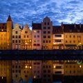 gdansk poland reflected in a river at dusk