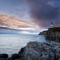 lighthouse atop seacoast cliffs