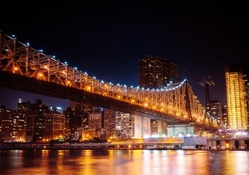 the queens borough bridge in nyc at night