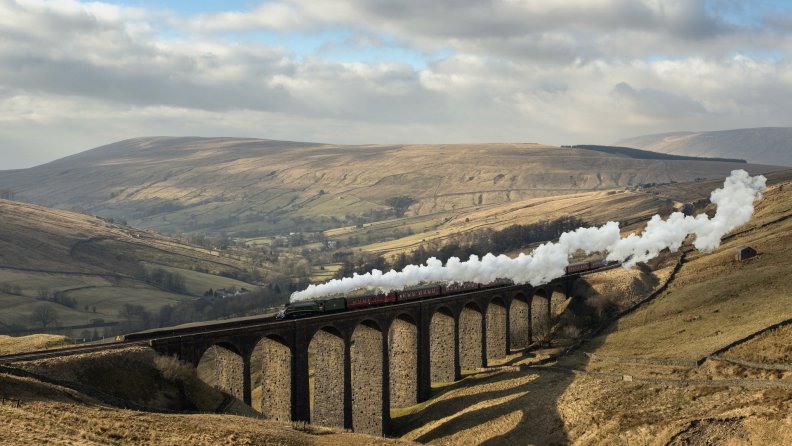 wonderful_steam_train_over_ancient_bridge.jpg