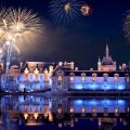 fireworks above a palace on a lake