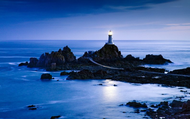 wonderful lighthouse on rocks off shore