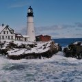lighthouse on a rough seashore in winter