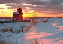 lighthouse in a winter sunrise