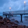 coastal pier on a stormy evening