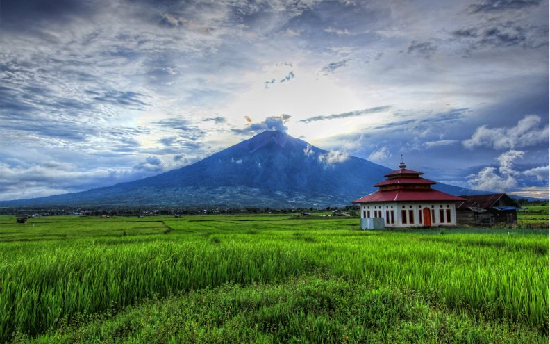 lovely_temple_in_the_fields_by_a_volcano.jpg