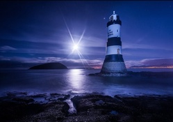 beautiful lighthouse under a bright moon