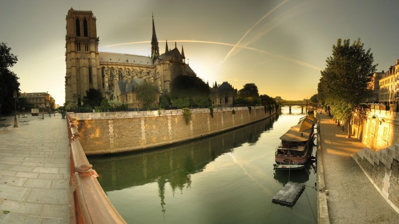 notre_dame_cathedral_by_the_seine_river.jpg