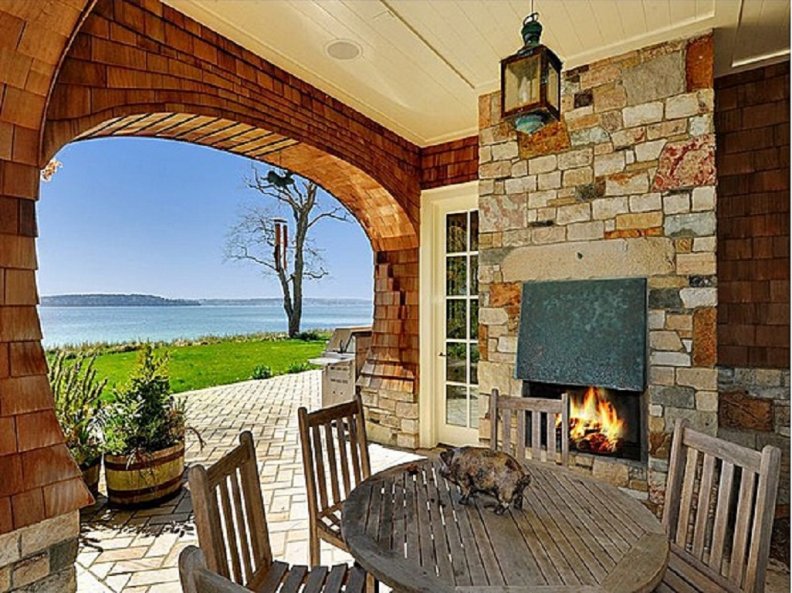 back_porch_with_fireplace_and_a_view_on_the_sea.jpg