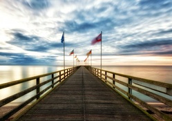 flags flapping on a wonderful sea pier