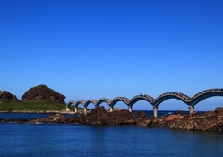amazing arched bridge at the seashore