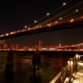 under the brooklyn bridge at night