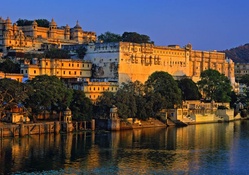 indian palace on the river at sunset