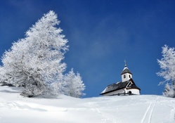 beautiful church on a hill in winter