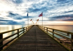 flags waving on a sea pier