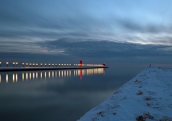 beacons on snowy shore and pier