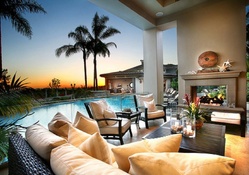 summer terrace with a pool and the fireplace