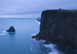 lighthouse over mystical seacoast