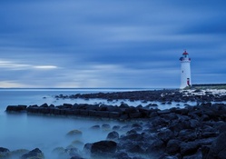 beautiful lighthouse on a rocky shore
