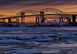 dual bridges over a river in winter