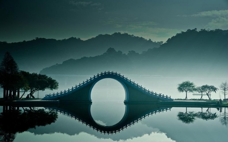 fantastic_bridge_on_misty_lake.jpg