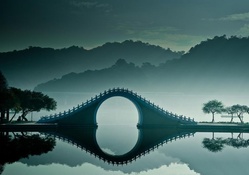 fantastic bridge on misty lake