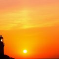 lighthouse and com antenna in glorious sunset