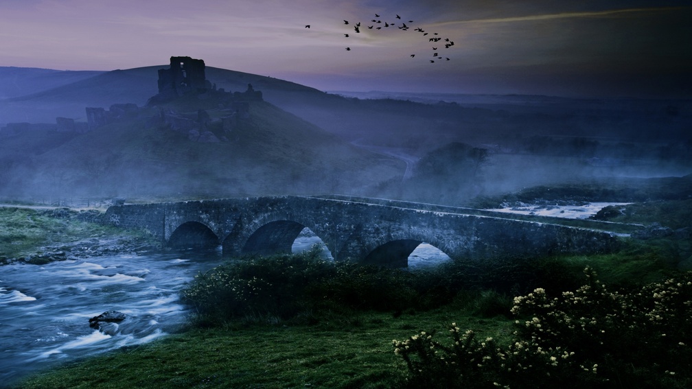ancient bridge over a river in the mist