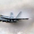 F_18 hornet through the smoke