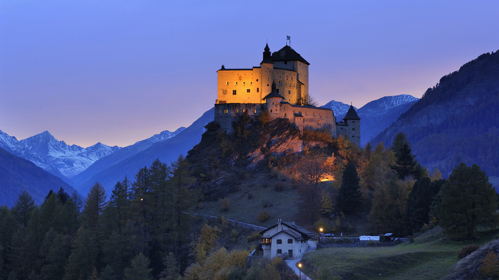 tarasp castle in switzerland at dusk