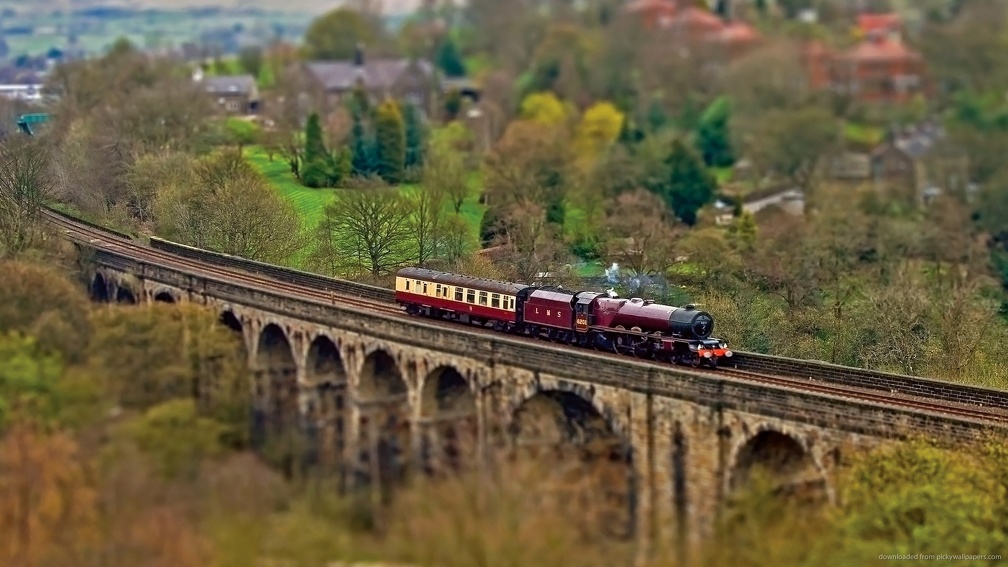 miniature steam train on a bridge