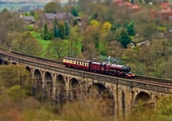 miniature steam train on a bridge