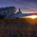 a DC_3 dakota on the prairie at sunset