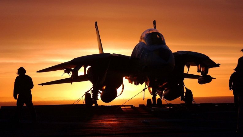 silhouette_of_f14_fighter_on_carrier_at_sunset.jpg