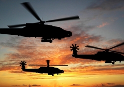 Boeing Apache Helicopters At Sunset