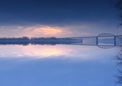 bridge over misty river