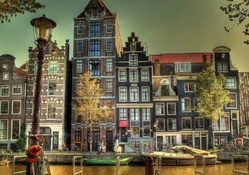 wonderful houses by the river in amsterdam hdr