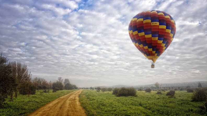 hot_air_balloon_above_a_country_road.jpg