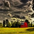 red barn under stormy clouds hdr