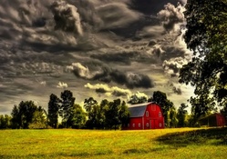 red barn under stormy clouds hdr