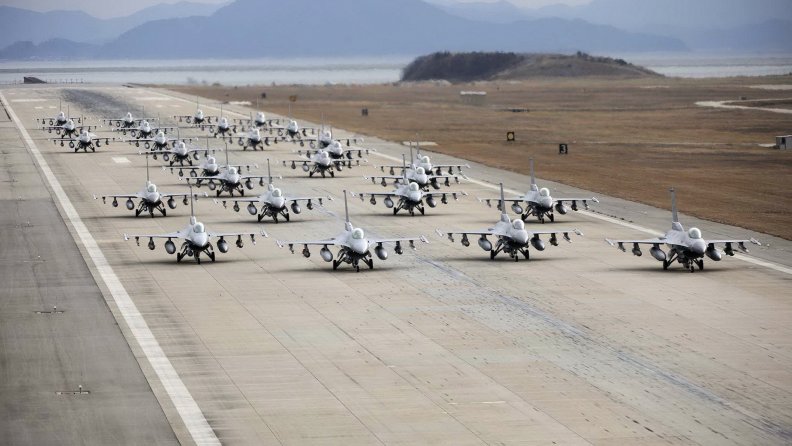 an_air_wing_of_f_16_falcons_on_a_runway.jpg