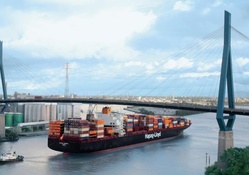 container ship under bridge in chicago