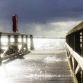 sea splashing through a wooden pier hdr