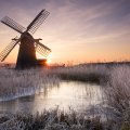 windmill in frosty sunrise in suffolk england