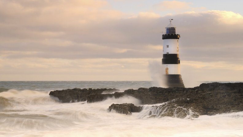 lighthouse_on_a_rough_shore_in_wales.jpg