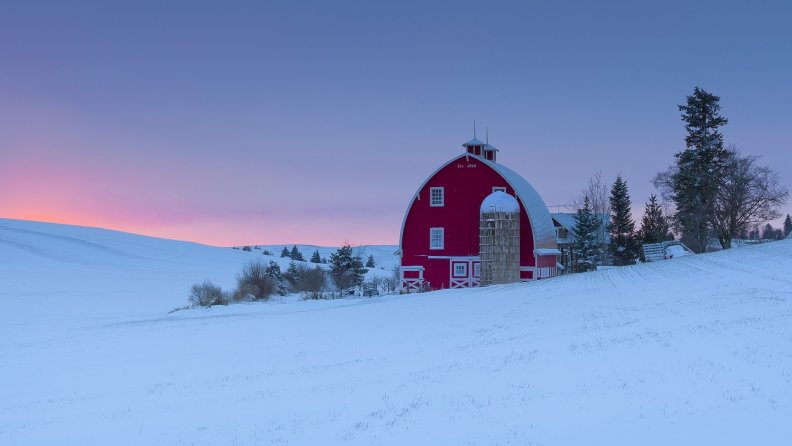 red_barn_and_silo_on_a_winters_sunset.jpg