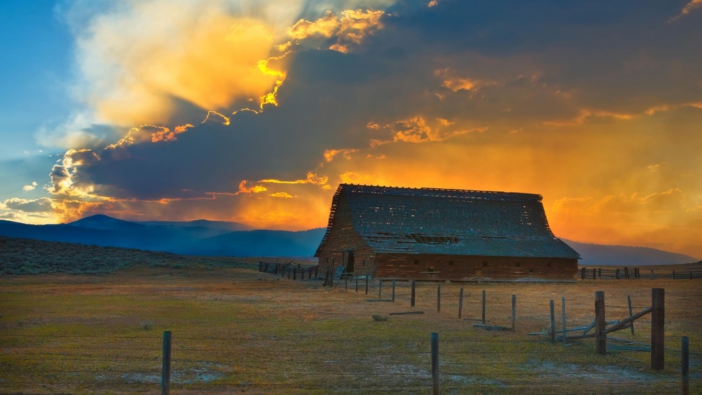 glorious sunset over old barn