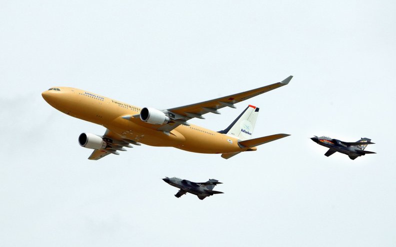 airbus_a330_with_two_fighters.jpg