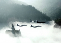 fighter planes over german castle in fog