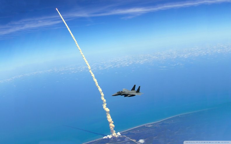 f14_over_shuttle_atlantis_liftoff.jpg